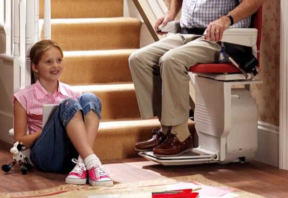 An unimportant image of a man using a stairlift